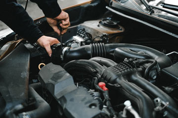 Man is Maintaining the Car