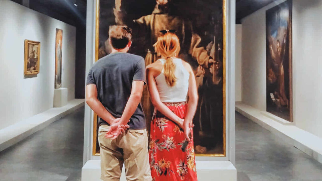 Man and Woman Standing in a Museum