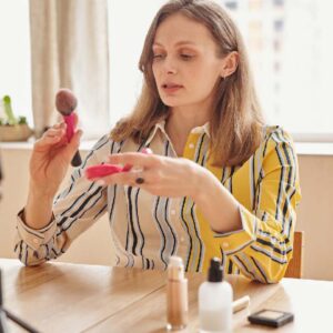 Woman Decluttering makeup products