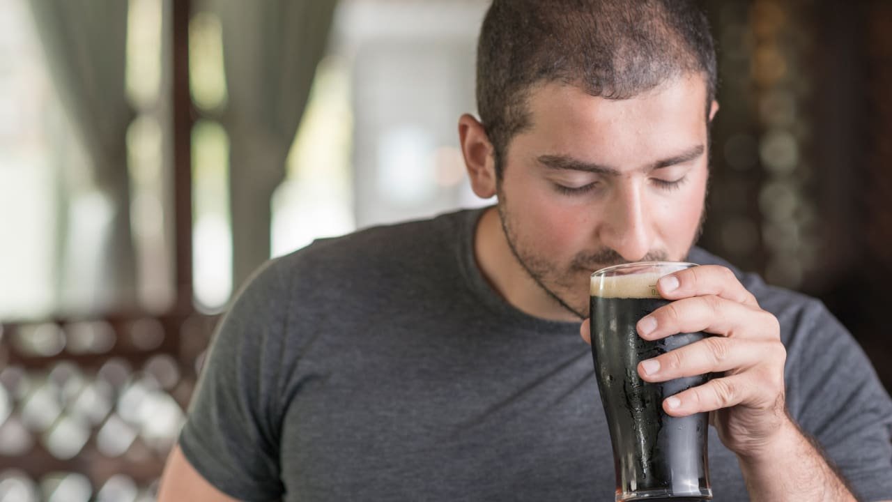 A boy is drinking soda