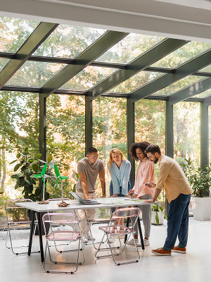 A group of four people discussing about the cost of sunroom