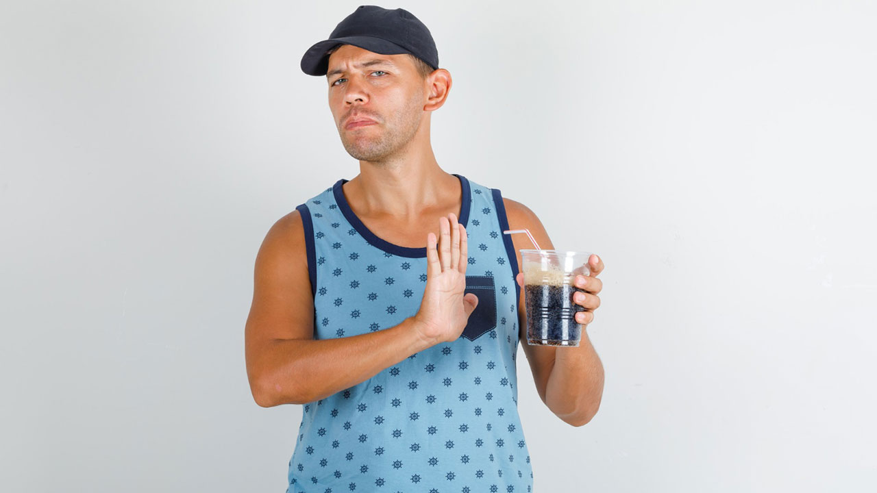 The boy avoids drinking the fizzy drink and clearly saying 
