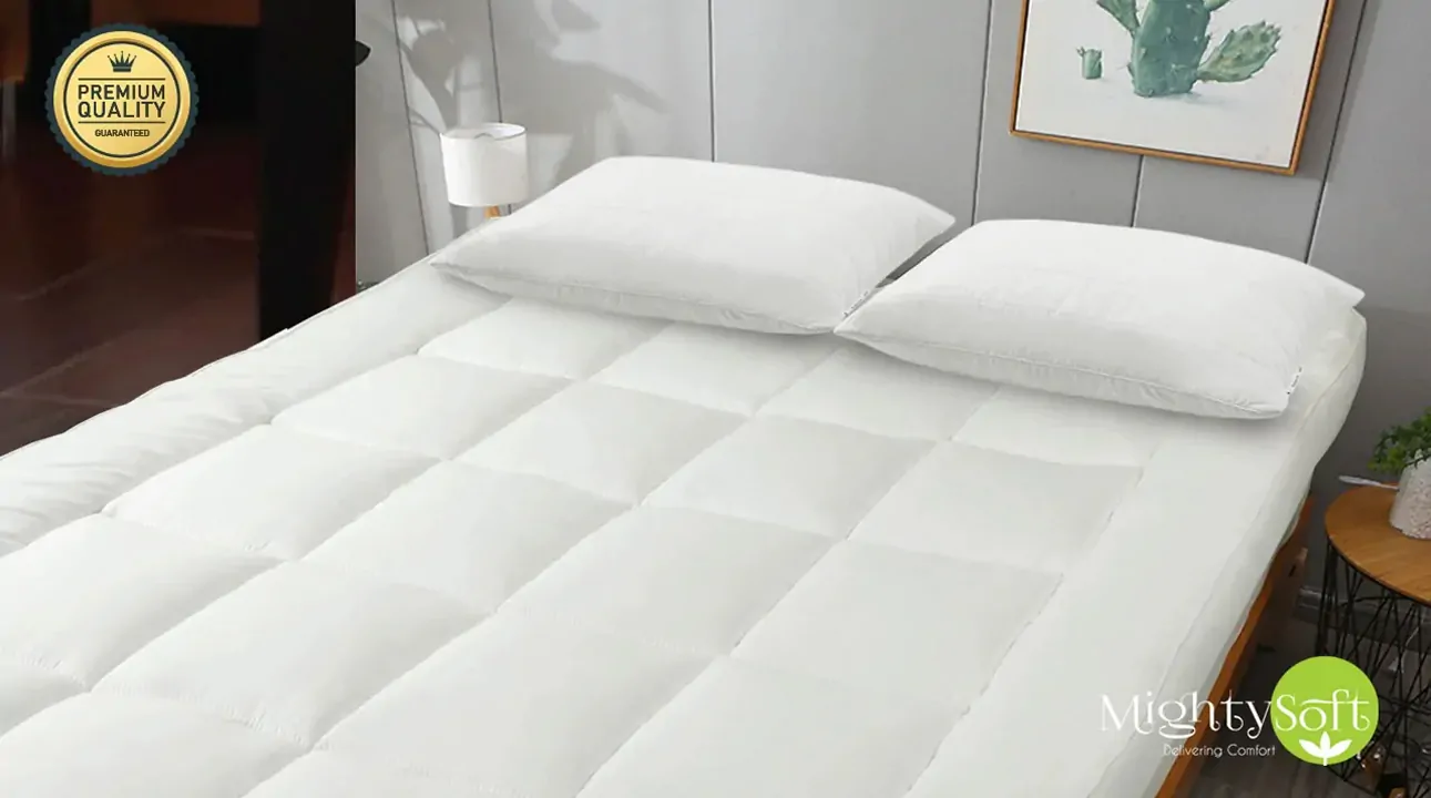 A white quilted mightysoft mattress topper